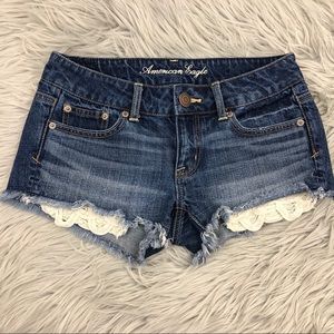 AMERICAN EAGLE DISTRESSED LACE POCKET SHORTS